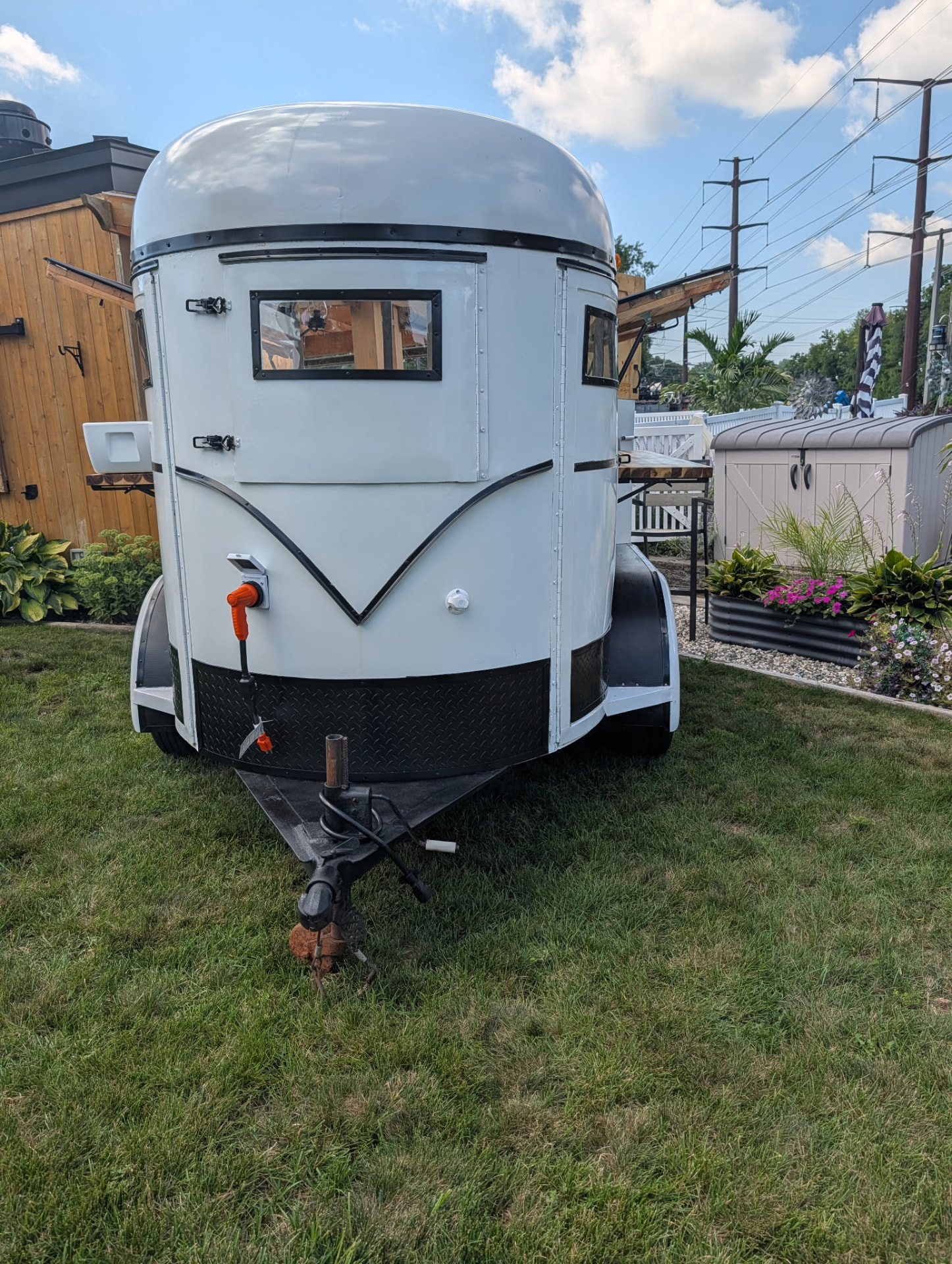 Front view of the vintage white horse-trailer bar