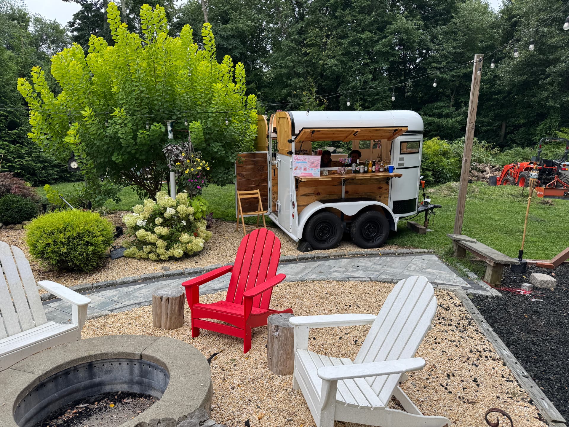 The White Pearl serving guests at a backyard garden party